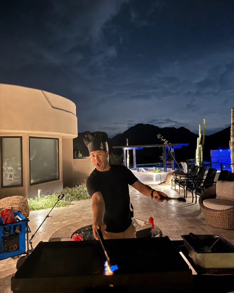 Private hibachi chef performing a flame show with Arizona mountains behind him
