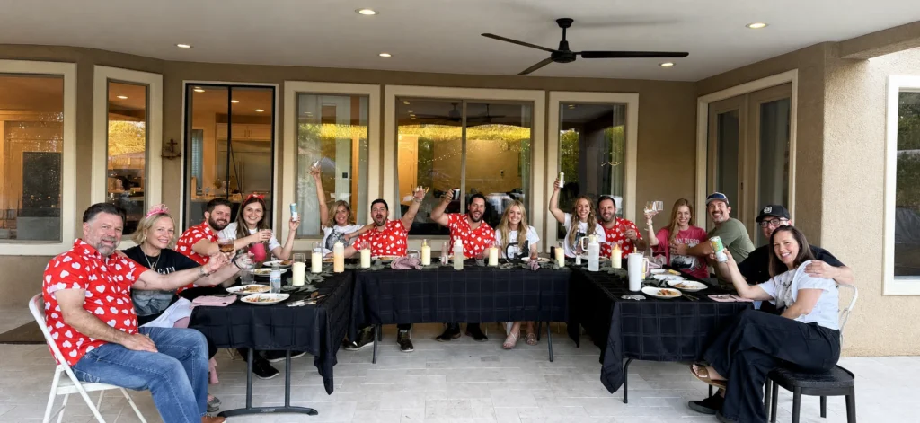 Large patio group raising a toast after hibachi dinner