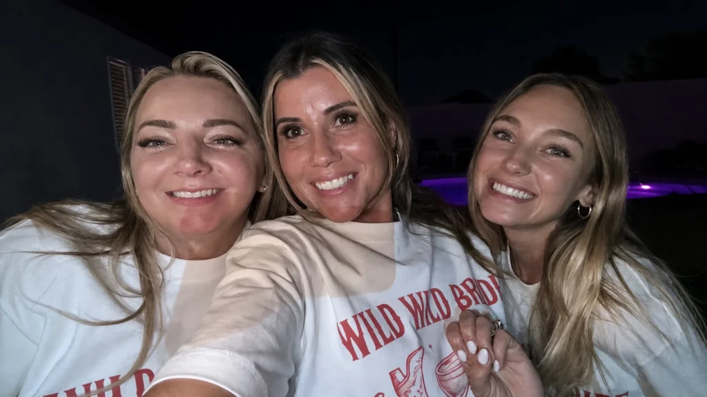 Bachelorette friends taking a nighttime group selfie