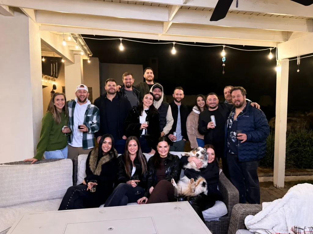 Friends and their dog gathered after a patio hibachi dinner